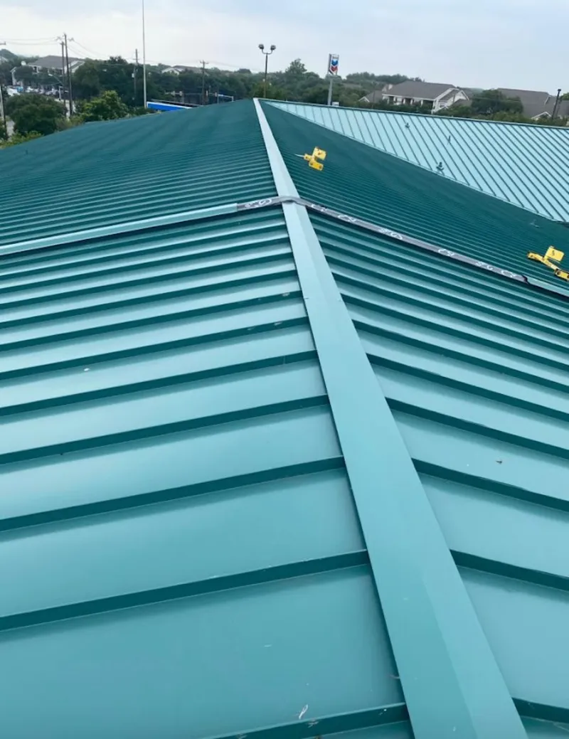 Green commercial metal roof ridge and valley for Metal Roof Repair in Jacinto City